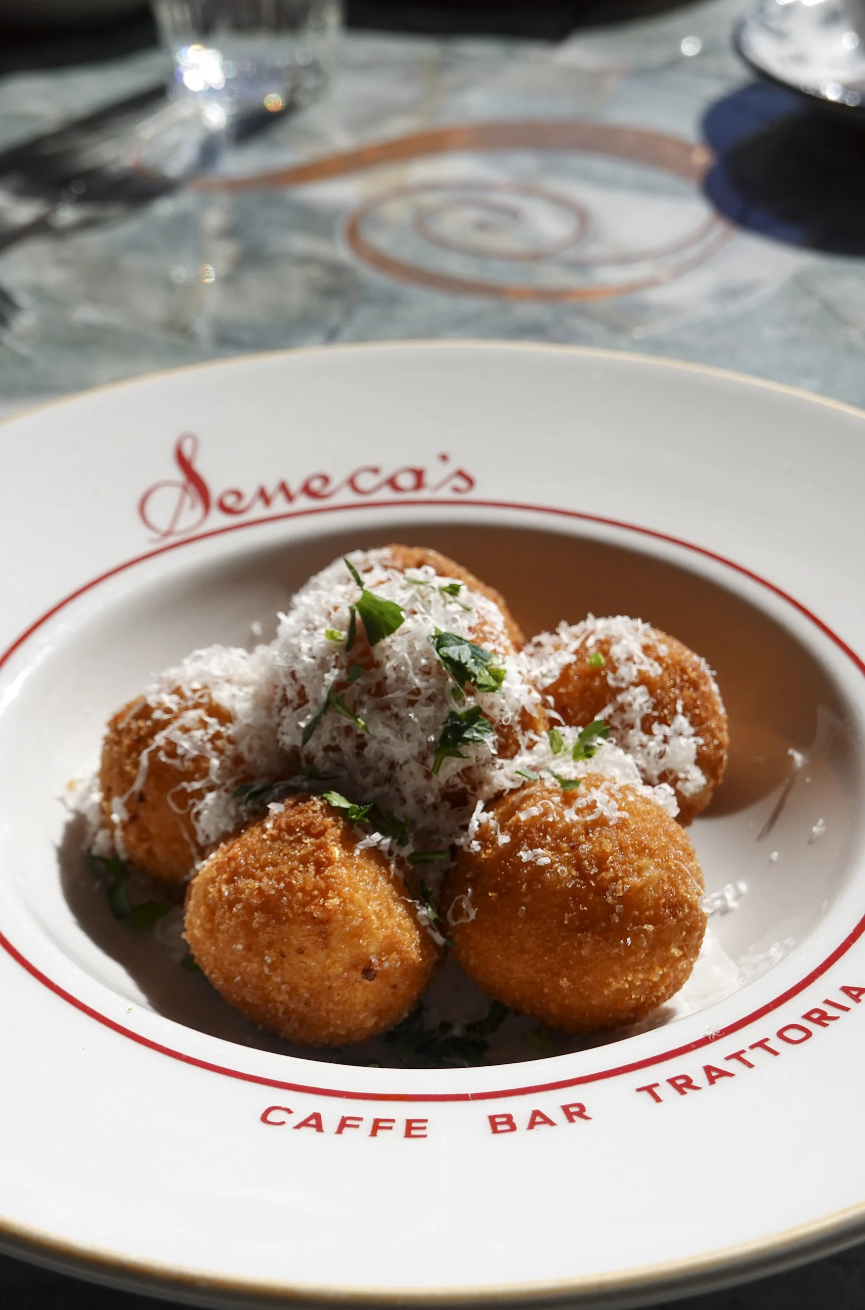 Seneca Trattoria signature dishes Truffle AranciniOxtailWood Fired Prawns